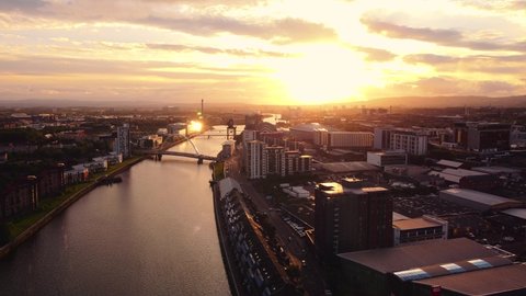 Glasgow, Scotland, UK : May 24 2022: Aerial drone shot Glasgow sunset views over river clyde to horizon
