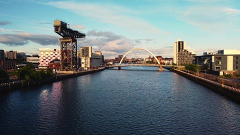 Glasgow, Scotland, UK : May 24 2022: Aerial drone shot Glasgow sunset view of river clyde crane and bridge