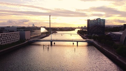 Glasgow, Scotland, UK : May 24 2022: Aerial drone shot Glasgow sunset flying over river clyde