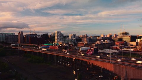 Glasgow, Scotland, UK : May 24 2022: Aerial drone shot Glasgow sunset traffic crossing Kingston bride into city centre with city skyline 