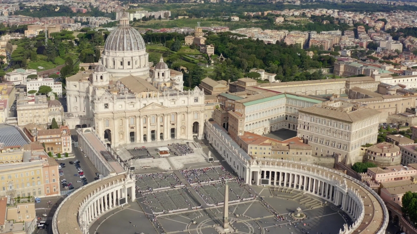 Aerial view of Papal Basilica of Saint Peter in the Vatican located in Rome, Italy, before a weekly general audience. It's the most important and largest church in the world and residence of the Pope. Royalty-Free Stock Footage #1090634307