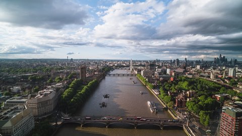 Stellar View and superb weather,  Aerial Hyperlapse Timelapse View Shot of London UK, United Kingdom, West Entrance to the capital city, Palace of Westminster, Parliament, flight over Thames River