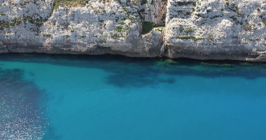 Aerial view of cliffs, stones and sea. spring time. Europe. The camera moves forward. Island of Malta