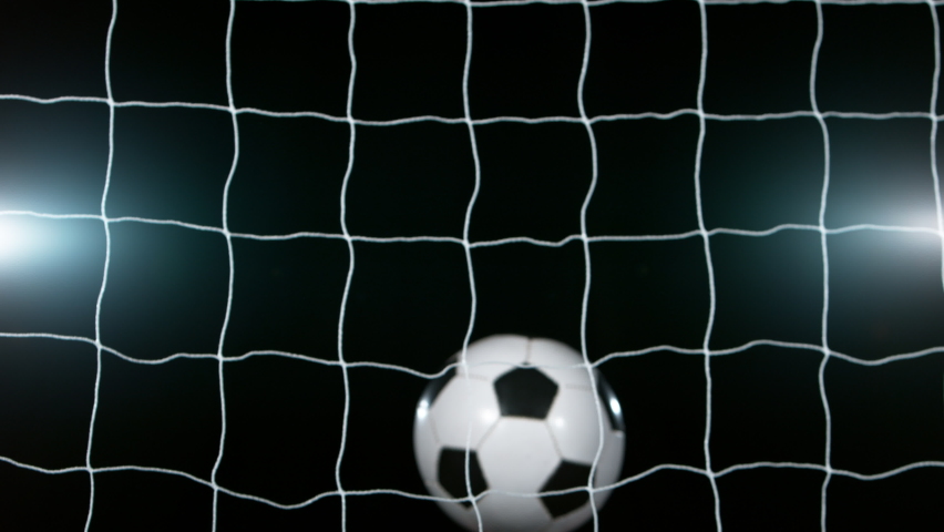 Close-up of Soccer Ball Hitting Goal Net, Super Slow Motion at 1000 fps. Filmed on High Speed Cinematic Camera. Royalty-Free Stock Footage #1090642835