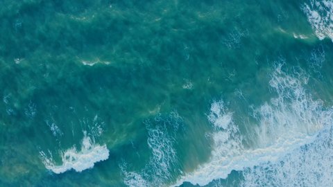 Aerial view to ocean waves. Close-Up Of Wave In Sea Blue water background with white wave, Turquoise blue sea water wave pattern, Waves in ocean Splashing Waves, Ocean wave top view. Copy Space,
