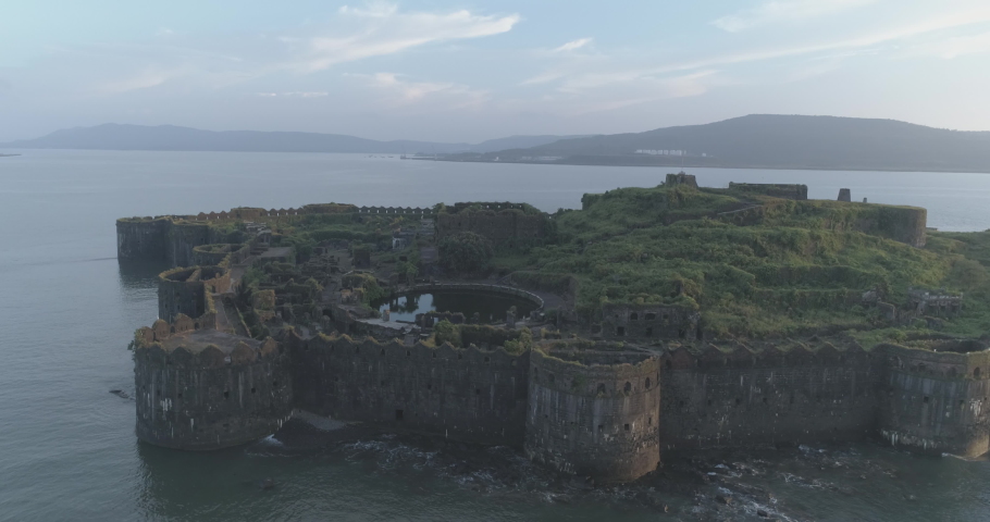 Aerial view of the Murud Janjira Fort, a ruined marine fortress dating from the 15th century situated on an island just off the coastal town of Murud in the Raigad district of Maharashtra India Royalty-Free Stock Footage #1090649047