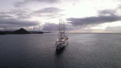 Big cruise ship anchored in Rodney Bay, Saint Lucia. Aerial view of boat on a cloudy evening. Luxury cabin cruiser at dusk, near Caribbean island.