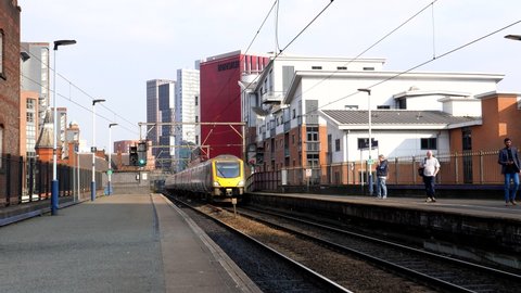 MANCHESTER, ENGLAND, UNITED KINGDOM - 03.24.2022: Northern train going to Blackpool arriving at Deansgate station and stopping at platform
