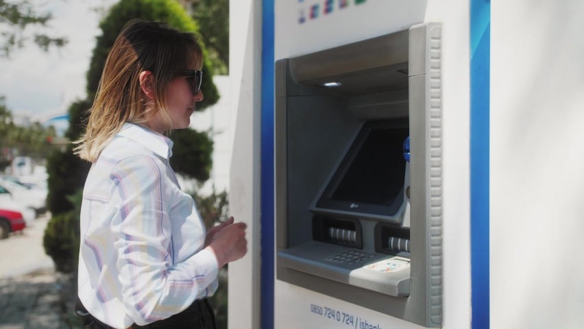 ATM concept. Person typing personal pin code in ATM cash machine. Woman withdraw money in atm machine. Royalty-Free Stock Footage #1090651931