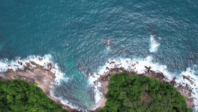 Aerial view of seashore in phuket island.Beautiful sea surface Amazing waves seascape mountain view in Phuket Thailand.High quality footage from drone 4K