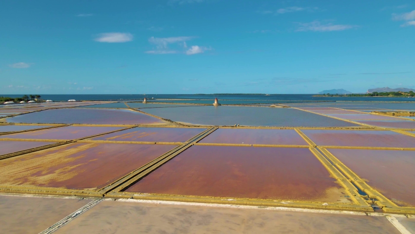 Trapani windmills, Natural reserve of the Saline dello Stagnone, near Marsala and Trapani, Sicily., Aerial picture of Trapani salt evaporation ponds and salt mounds windmill 