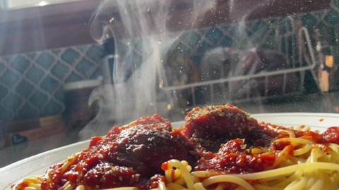 Spaghetti noodles and meatballs on white plate