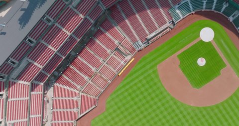St. Louis , MO , United States - 05 21 2022: Drone Shot Above Bright Green Baseball Diamond in Sports Stadium with Empty Bleachers