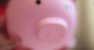 4K Video slow motion asian kid hug her piggy bank. Concept for financial and saving bank for child.