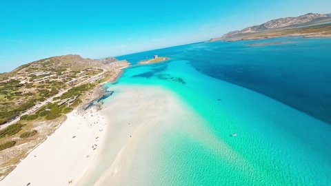 Стоковое видео: View from an FPV drone of the Pelosa beach in Stintino, north Sardinia.