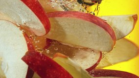 Super slow motion of rotating sliced red apples pieces underwater. Filmed on high speed cinema camera, 1000 fps. Speed ramp effect. - Powered by Shutterstock - Get 15% off with code: PIKWIZARD15