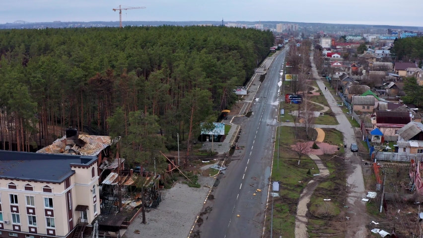 Top view of the road. Aerial view of the destroyed and burnt houses. Houses were destroyed by rockets or mines from Russian soldiers.