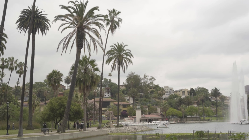 Homes on the hillside with Echo Park Lake and the water fountain in the foreground