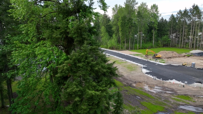 Establishing aerial shot of a construction site with future house lots.