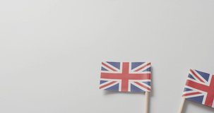 Video of flags of great britain lying on white background. nationality, state symbols, patriotism and independence concept.