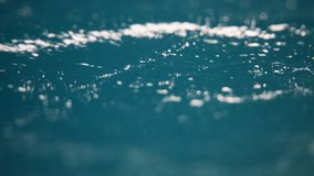 Water surface texture, Slow motion clean ocean ripples and wave, Refraction of sunlight top view texture sea side white sand, sun shine water background. Water Caustic Background. Light Rays Dark - Powered by Shutterstock - Get 15% off with code: PIKWIZARD15