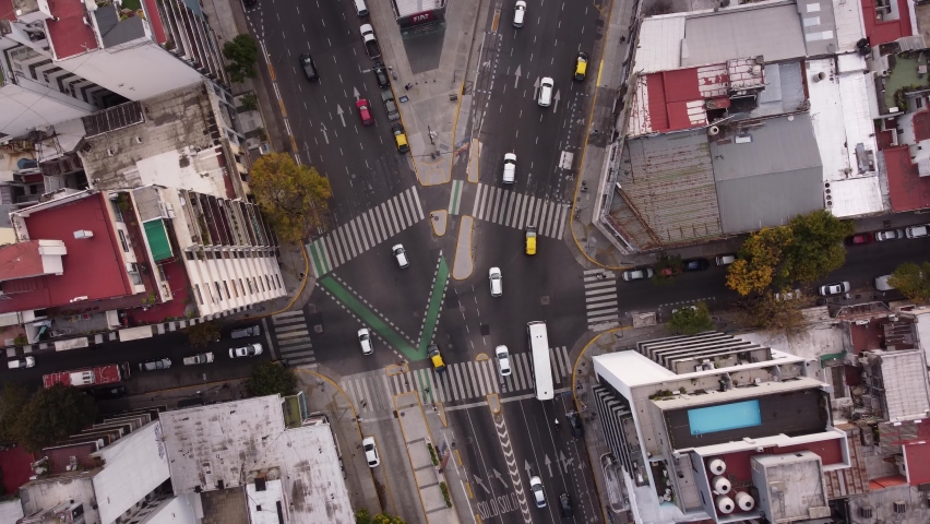 Aerial straight down view of Cordoba Avenue fork in Buenos Aires city during rush hour time in the evening,4K