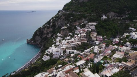 Dramatic setting of cliffside village overlooking Amalfi Coast, Positano; drone