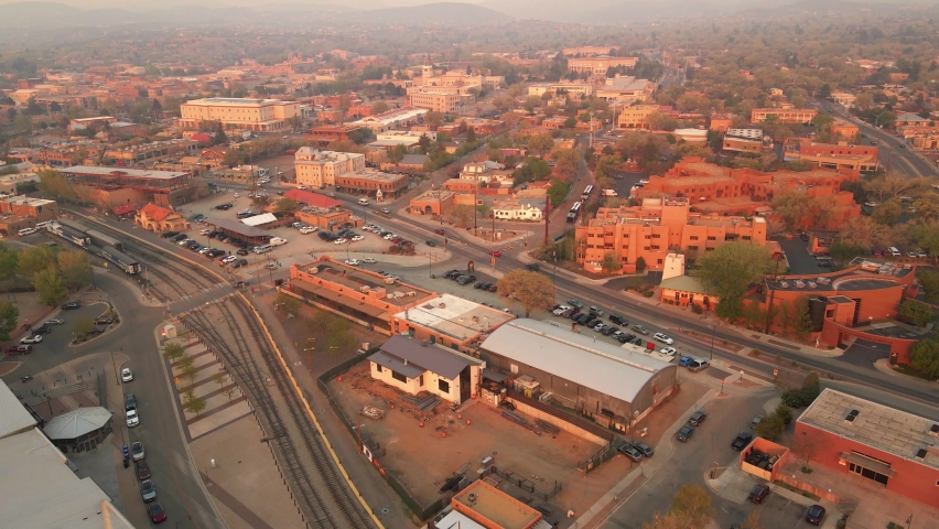 Aerial view overlooking the railroad station and the city of Santa Fe, covered in wildfire haze - circling, drone shot
