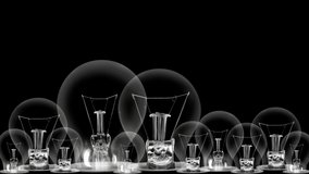 Light bulbs going from dark to light with Wealth Management, Business, Assets, Investment and Profit fiber text on black background. High quality 4k video.