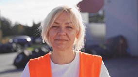Close up portrait of worker engineer woman with orange vest. Female truck driver  - Powered by Shutterstock - Get 15% off with code: PIKWIZARD15