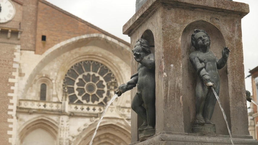 Change of focus between the monumental fountain and the facade of the Cathedral of Saint-Etienne, Toulouse, France