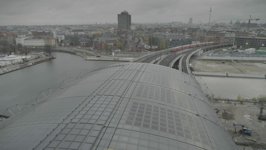Elevated view over roof of Berlin Central train station of trains arriving Royalty-Free Stock Footage #1090705457