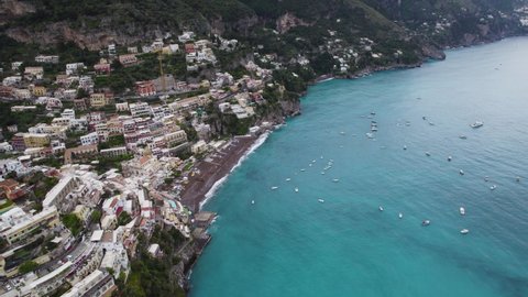 Colorful cliffside villas of Positano, Amalfi Coast, Italy; aerial arc view