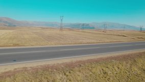 Long Highway Across Rural Fields. Road. Highway. Way. Freeway. Aerial Video. Landscape. Cars on the Highway.