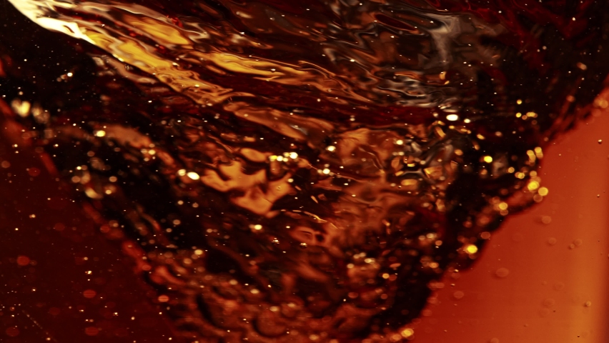 Super Slow Motion Shot of Pouring Cream or Milk into Coffee Whirl at 1000fps. Royalty-Free Stock Footage #1090714027