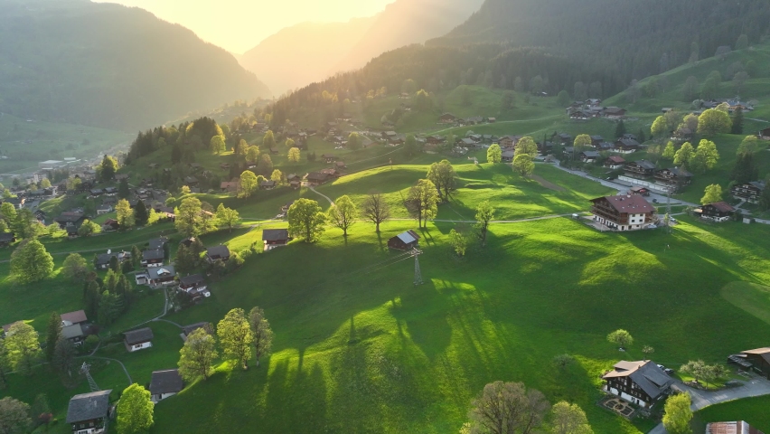 Idyllic mountain landscape in Switzerland, aerial Swiss rural landscape in the morning, alpine village of Grindelwald in Swiss Alps, Swiss nature. High quality 4k footage