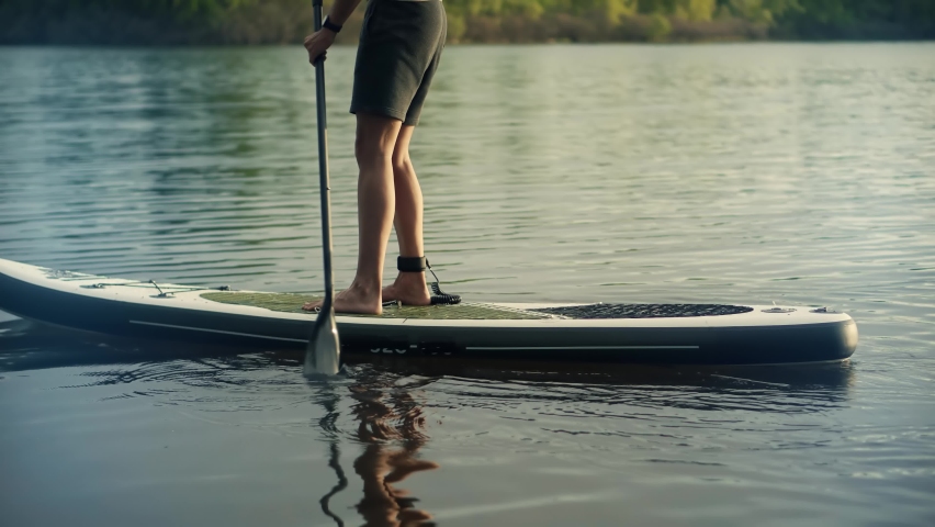 Paddleboarder Sport Sup Surfing. Recreation Paddling Surfboard. Inflatable Board Rowing. Surfer Recreation Sport Watersport Activity .Travelling Water Tourism. Raft On SUP. Paddler Surfing Exploration Royalty-Free Stock Footage #1090731755