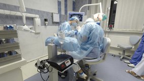 Dentists during surgery for implant placement timelapse. Dentist team working with patient. Bright and modern european stomatology - Powered by Shutterstock - Get 15% off with code: PIKWIZARD15