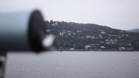 cinematic effect and panoramic shot of Como city from the lakeshore in a cloudy day