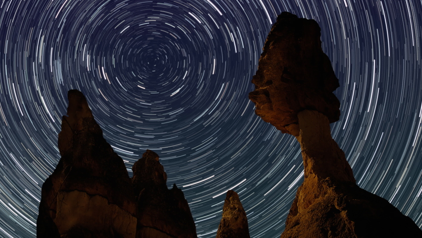 Vortex Star Trails over Fairy Chimneys in Cappadocia. Volcanic rock formations and stary night. [ProRes - UHD 4K] - Powered by Shutterstock - Get 15% off with code: PIKWIZARD15