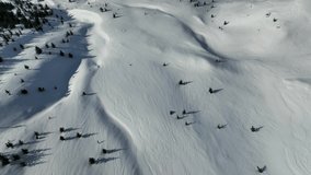 Snowmobile high in the mountains aerial view 4 K