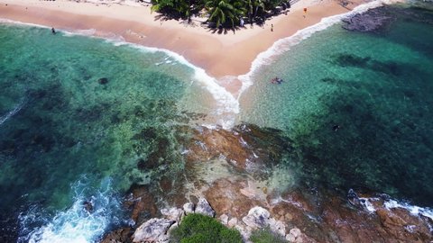 Professional video Aerial view of drone. Scene of top view beach and seawater on sandy beach in summer. Nature and travel concept. Location Phuket Thailand 