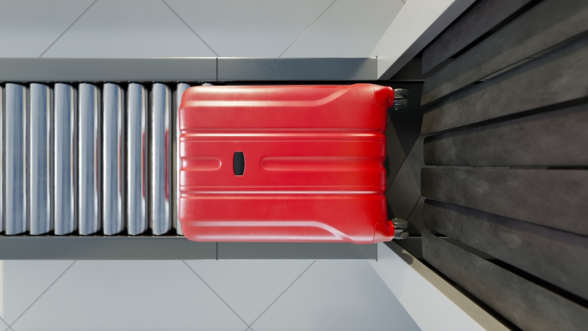 Top view of a red suitcase on the conveyor belt and inside the scanner. Closer look at airport baggage with X-rays to see through the surface of the suitcase. Airport security checkpoint analysis.