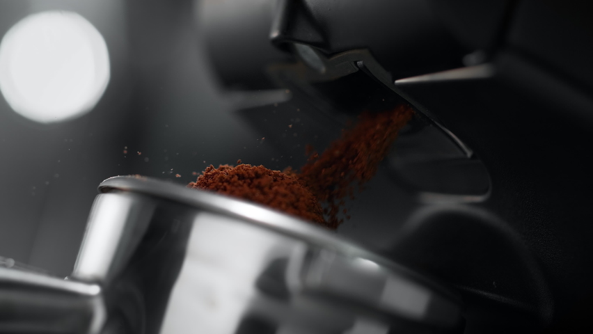 Ground Coffee Pouring out of Grinder and Falling into Portafilter in Slow Motion Royalty-Free Stock Footage #1090764173