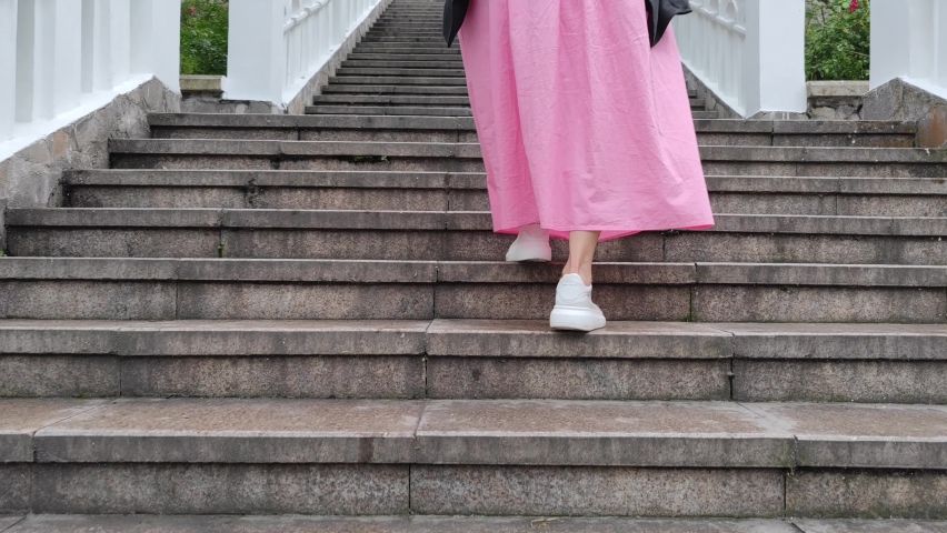 A woman was walking on the steps