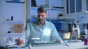 Lab scientist looking at virus hologram on computer screen, writing test data - Powered by Shutterstock - Get 15% off with code: PIKWIZARD15