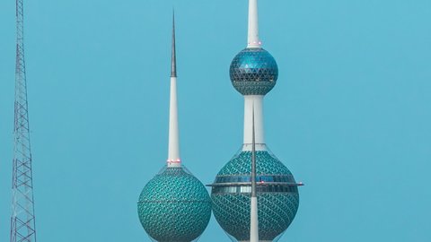 KUWAIT - CIRCA NOV 2019: Top view of Kuwait Towers day to night transition timelapse illuminated at night - the best known landmark of Kuwait City. Kuwait, Middle East.