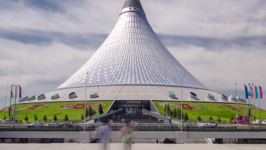 Khan Shatyr timelapse hyperlapse in Nur-Sultan, Kazakhstan. Khan Shatyr located in Astana, the capital of the Republic of Kazakhstan. Residents of the city are walking and resting. Royalty-Free Stock Footage #1090772157