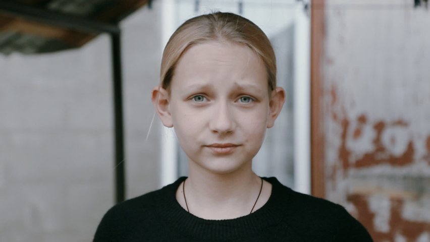 portrait of a cute girl talking to the camera
