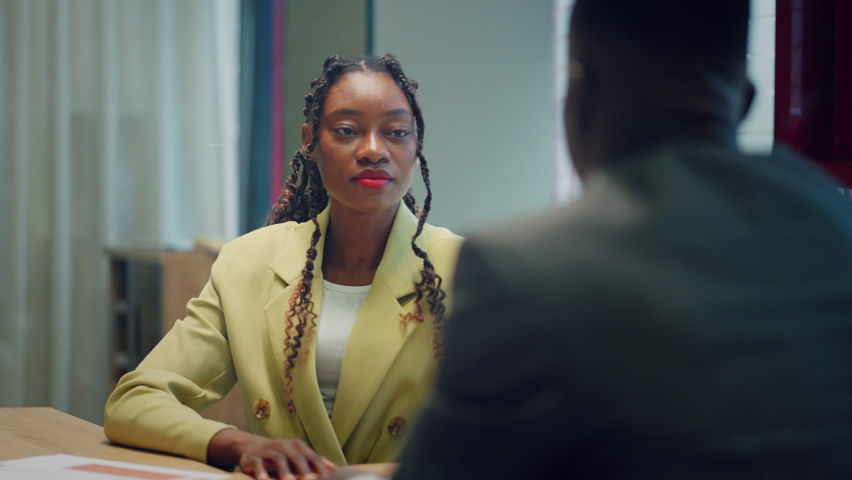 Happy confident black woman recruit handshaking employer getting hired at new job. Smiling young female professional manager shake hand of black man client or customer making business office meeting Royalty-Free Stock Footage #1090777299